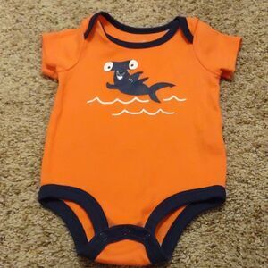 Lullaby 6-9 mo onesie‎ with hammerhead shark, orange with navy trim snap crotch